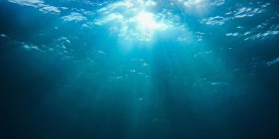 Light breaking through a deep ocean